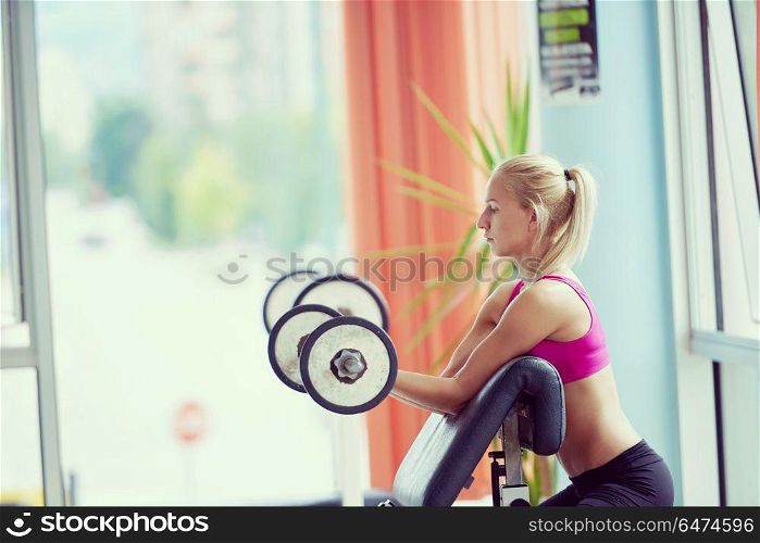 young sporty woman with trainer exercise weights lifting in fitness gym. young sporty woman with trainer exercise weights lifting