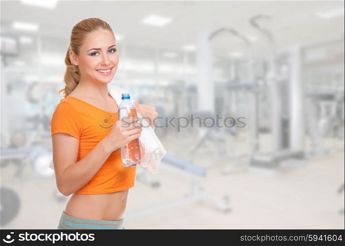 Young sporty woman with water bottle