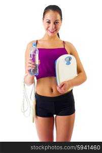 Young sporty woman with water bottle and scales isolated