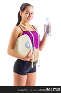 Young sporty woman with water bottle and scales isolated