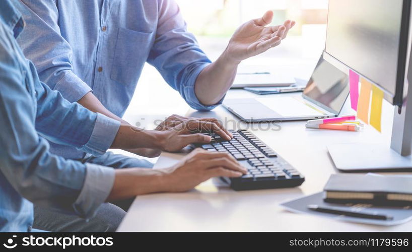 Young startup Programmers Sitting At Desks Working On Computers screen for Developing programming and coding to find solution to problem on New Application