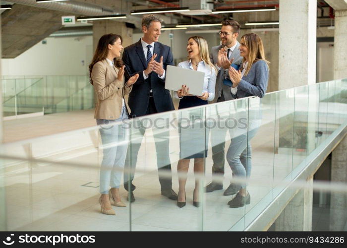 Young startup team working in the modern office corridor