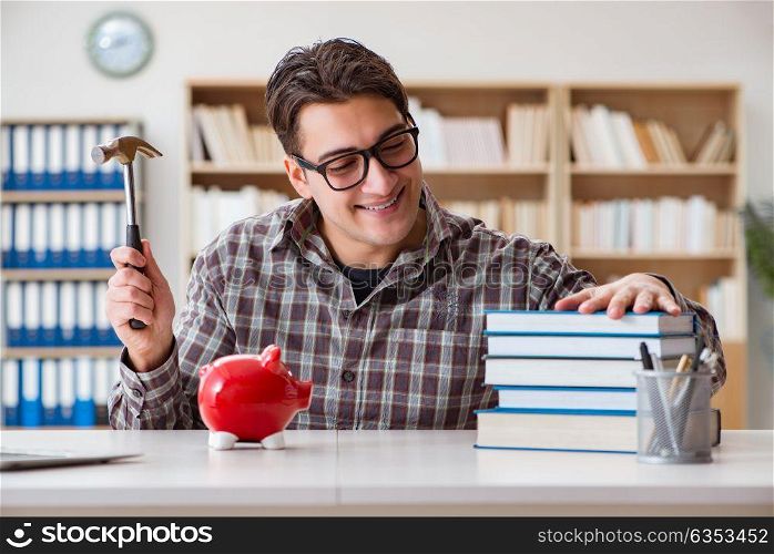 Young student breaking piggy bank to buy textbooks
