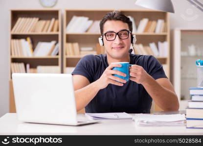 Young student drinking coffee from cup