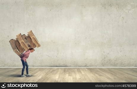 Young student girl lifting pile of old books on back. Master science