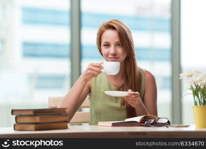 Young student preparing for exams drinking tea