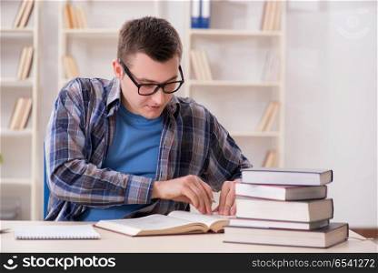 Young student preparing to school exams with books