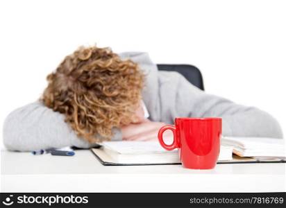 Young student sleeping on his desk