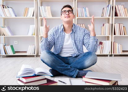 Young student studying with books