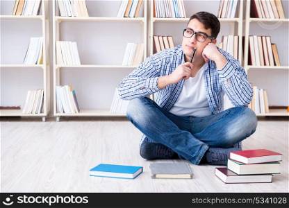 Young student studying with books