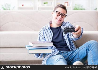Young student trying to balance studying and playing games
