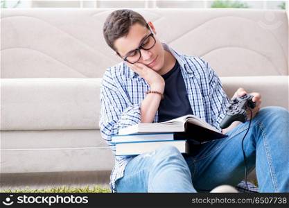 Young student trying to balance studying and playing games