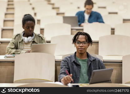 young students attending university class