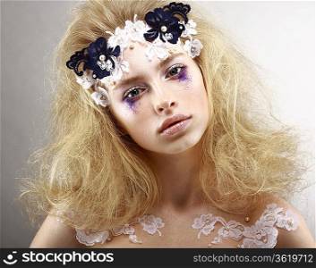 Young Styled Blonde with Colorful Makeup - Blue Eye Shadows. Arts