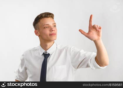 young stylish businessman. portrait of young stylish businessman on gray background