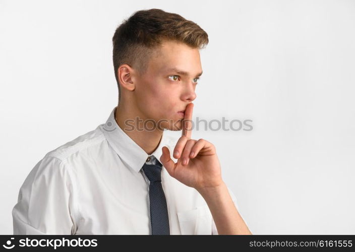 young stylish businessman. portrait of young stylish businessman on gray background