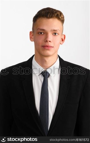 young stylish businessman. portrait of young stylish businessman on gray background