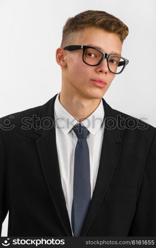 young stylish businessman. portrait of young stylish businessman on gray background