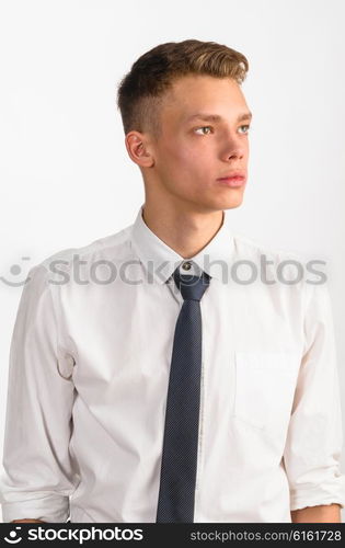 young stylish businessman. portrait of young stylish businessman on gray background