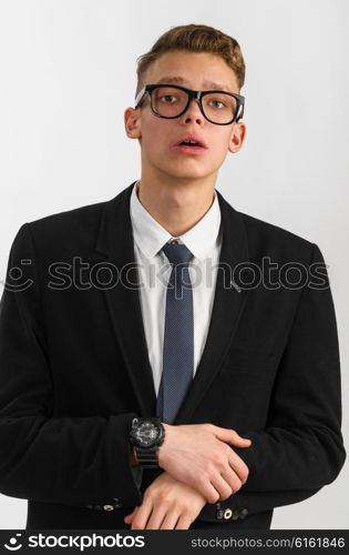 young stylish businessman. portrait of young stylish businessman on gray background