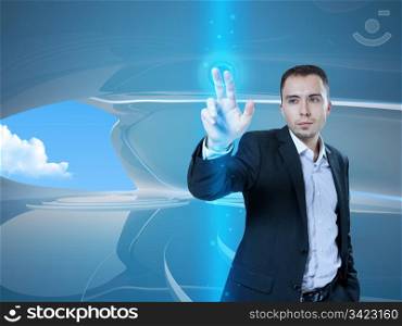 Young stylish businessman touching virtual interface button. Pillar of transparent blue light. Future bio style interior on background. Interfaces collection.