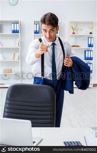 Young stylish businessman working in the office