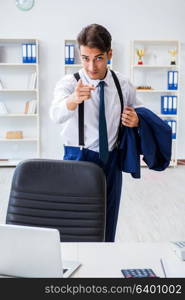 Young stylish businessman working in the office