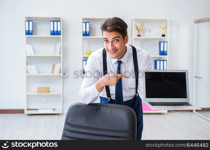 Young stylish businessman working in the office