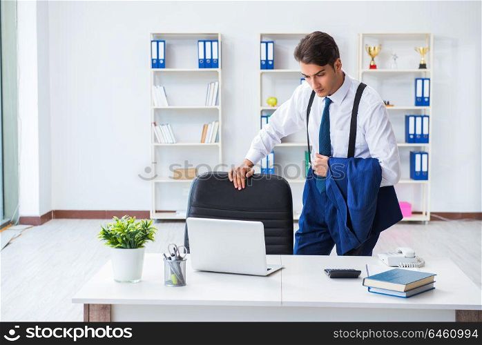 Young stylish businessman working in the office