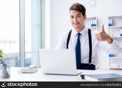 Young stylish businessman working in the office