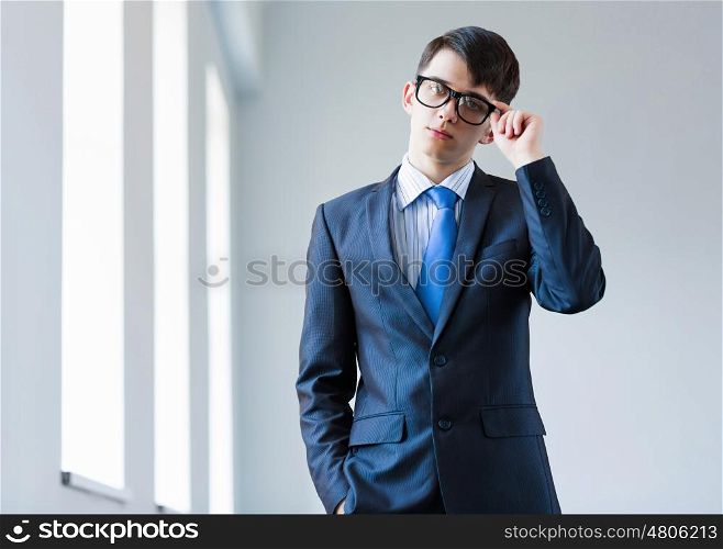 Young successful businessman. Image of handsome confident businessman in glasses