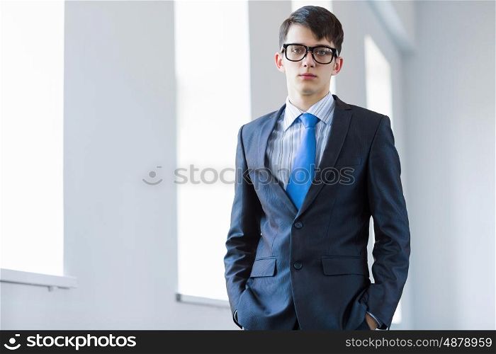 Young successful businessman. Image of handsome confident businessman in glasses