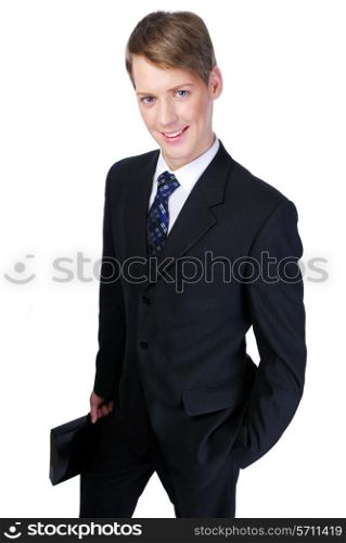 Young successful businessman standing and holding the black briefcase. On white background