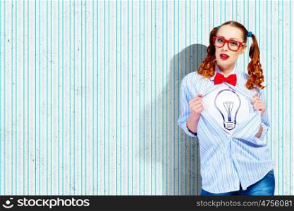 Young super hero woman. Young woman acting like super hero with bulb illustration on chest