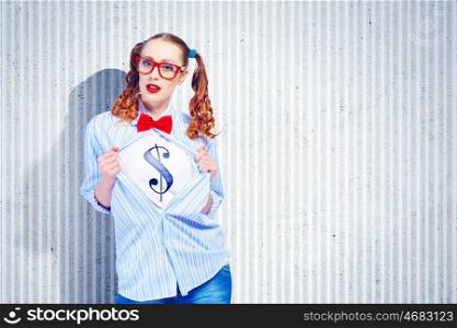 Young super hero woman. Young woman acting like super hero with dollar sign on chest