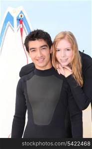 Young surf couple