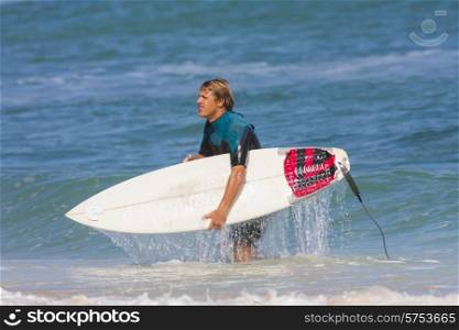 Young Surf Man Portrait at the Beach with a Surfboard.
