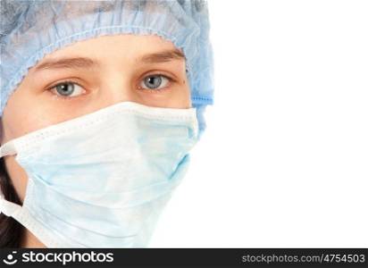 Young surgeon woman with blue eyes looking at camera