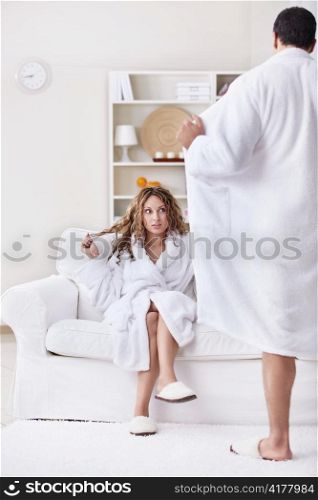 Young surprised girl and a man opened its robe