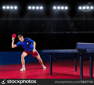 Young table tennis player at sports hall