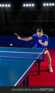 Young table tennis player at sports hall
