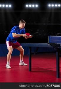 Young table tennis player at sports hall