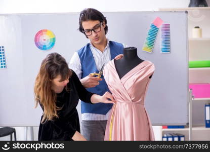 Young tailors working in workshop 