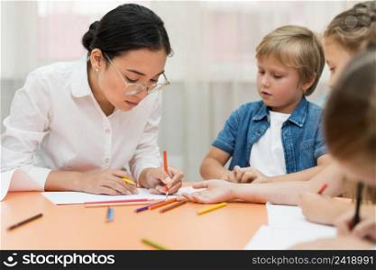 young teacher doing her class with kids