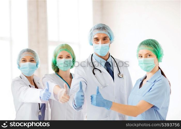 young team or group of doctors in operating room