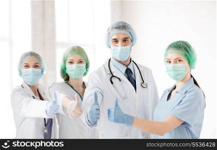young team or group of doctors in operating room