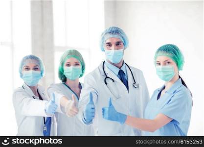 young team or group of doctors in operating room. group of doctors in operating room