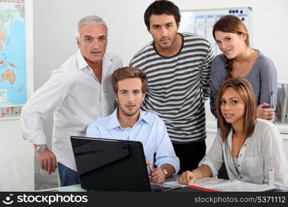 Young team working at a laptop