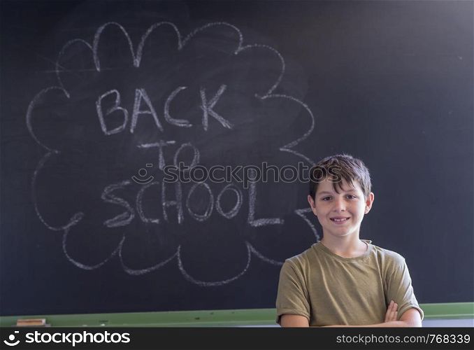 "Young teen and blackboard with " back to school " written . Education concept"