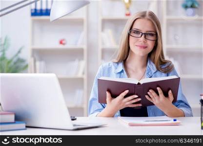 Young teenage female student preparing for exams at home. The young teenage female student preparing for exams at home